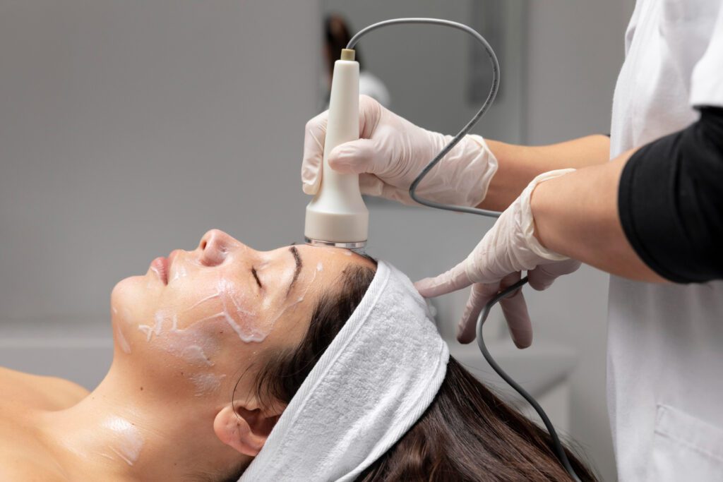 Dermatologist performing microneedling treatment on woman to reduce open pores and improve skin texture