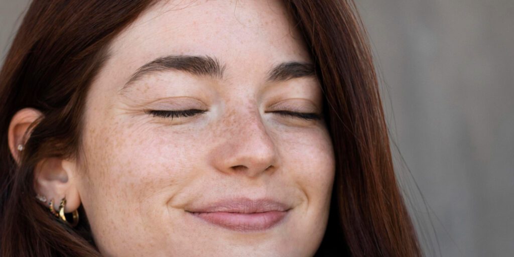 Close-up of a girl’s face showing sun tan marks, highlighting the need for remedies on how to remove sun tan from the face.