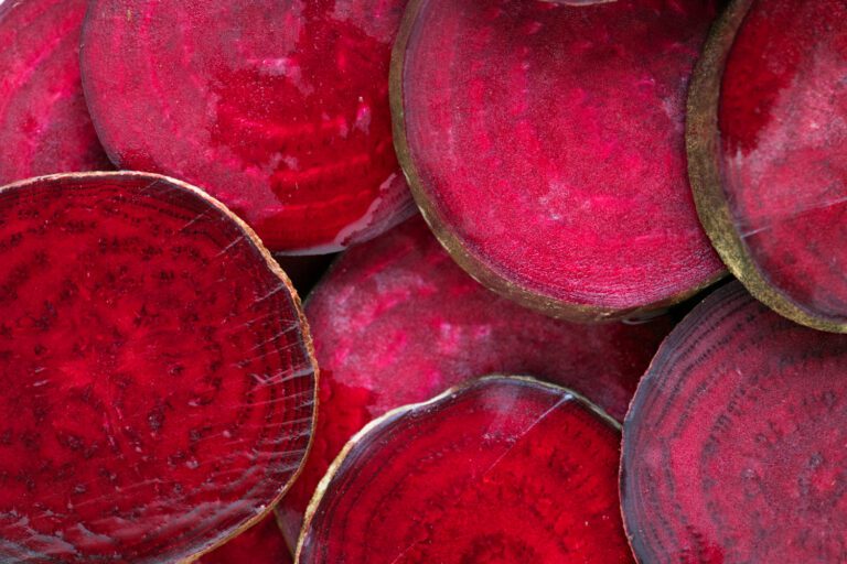 Fresh slices of beetroot, a natural ingredient rich in nutrients for glowing skin, used to make beetroot powder for skin care.